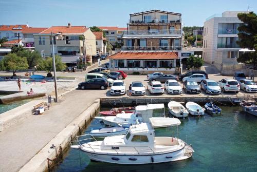a group of boats are docked in a marina at Hotel Delfin in Zadar