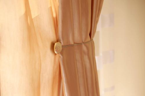 a close up of a dress with a button at Apartment Alexandar in Podgorica