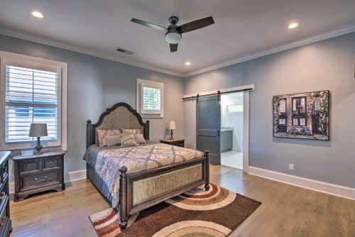a bedroom with a bed and a ceiling fan at Modern Atlanta Getaway about 3 Miles to Downtown! in Atlanta