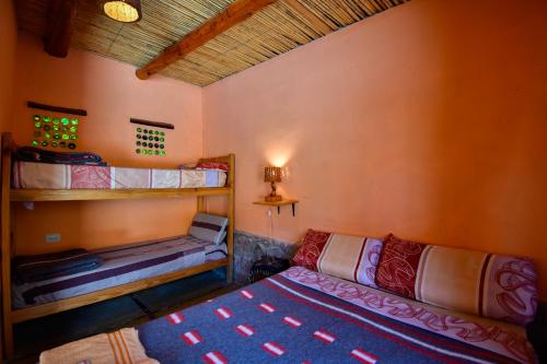 Ένα ή περισσότερα κρεβάτια σε δωμάτιο στο Tilcara Rustica Hostel