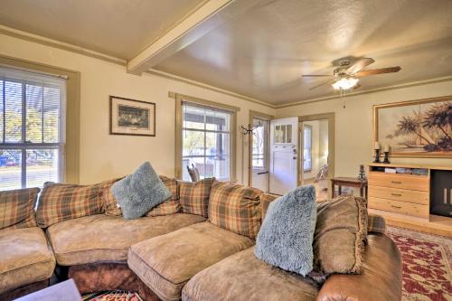 a living room with two couches and a ceiling fan at Charming Montana Home with Grill 6 Mi to Lake Elmo! in Billings