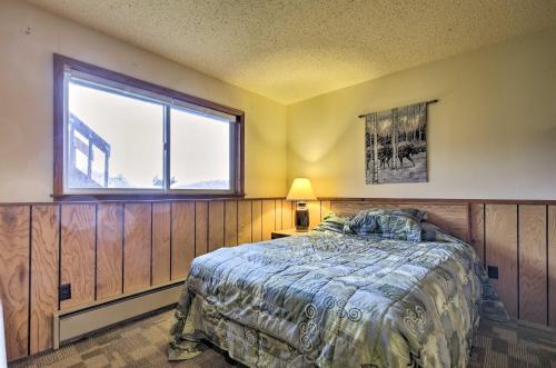 a bedroom with a bed and a window at Upson Ski-InandSki-Out, End-Unit Cabin with Fireplace! in Montreal