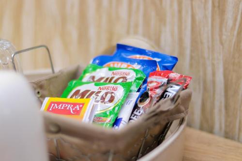 a basket filled with toothbrushes and toothpaste at Bays Lodge, Accra in Accra