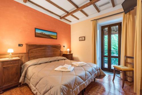 Ένα ή περισσότερα κρεβάτια σε δωμάτιο στο Casale dei Gelsi