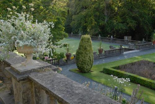 a garden with a large bush and some plants at Rydal Hall Christian Retreat Centre in Rydal