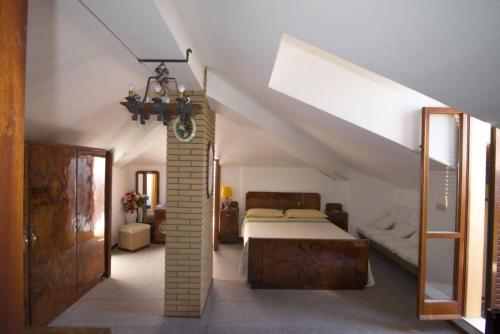 a bedroom with a bed in a attic at Cà La Terrazza in Gradara