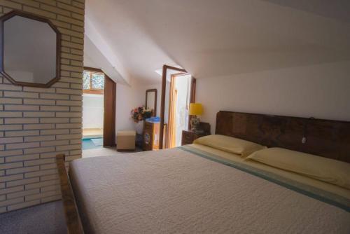 Cama o camas de una habitación en Cà La Terrazza - DENTRO IL BORGO STORICO