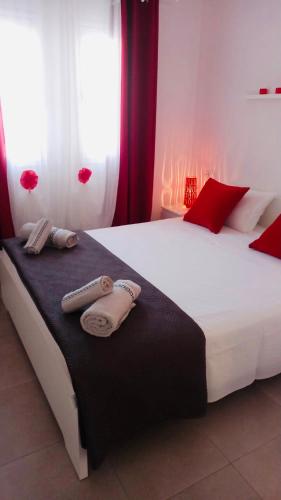 a bedroom with a large white bed with towels on it at Corralejo Sun 202 in Corralejo