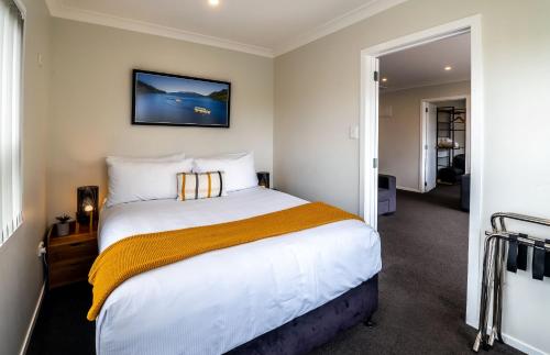 Ένα ή περισσότερα κρεβάτια σε δωμάτιο στο Aura Accommodation