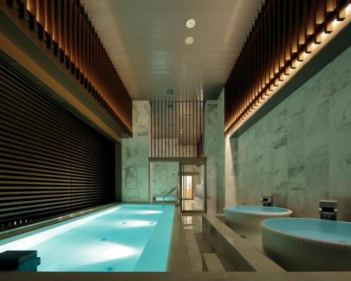 a bathroom with two sinks and two bath tubs at Candeo Hotels Kyoto Karasuma Rokkaku in Kyoto