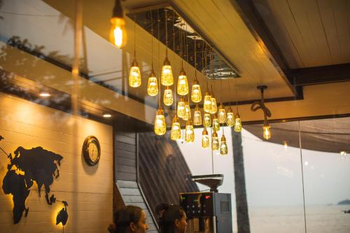 a group of lights hanging from a building at The Ark Comforts in Palolem