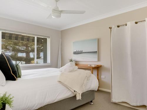 Ένα ή περισσότερα κρεβάτια σε δωμάτιο στο Ocean Blue Apartment Four