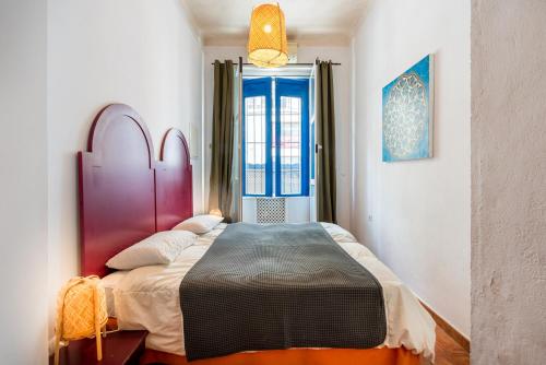 Postel nebo postele na pokoji v ubytování El Patio Andaluz