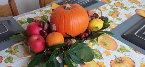 a bunch of fruits and vegetables on a table at Ad Astra Rooms in Ravenna