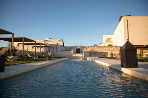 Swimming pool sa o malapit sa Masseria Amastuola Wine Resort