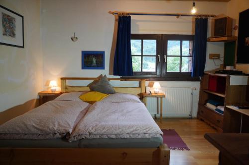 Postel nebo postele na pokoji v ubytování Wohnstudio in umgebauter Scheune