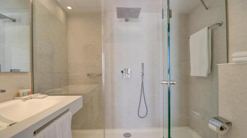a bathroom with a shower and a sink at Hotel Illa d'Or & Club Apts 4* Sup in Port de Pollensa