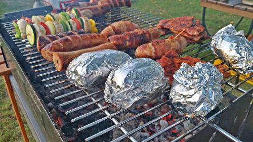 a grill with many different types of food on it at Gościniec pod Żaglami in Skoki Duże