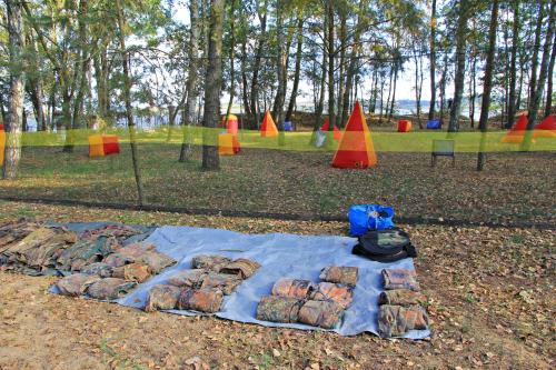a blanket that is on the ground in a park at Gościniec pod Żaglami in Skoki Duże