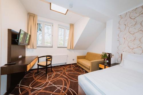 Katil atau katil-katil dalam bilik di Hotel Hubertus