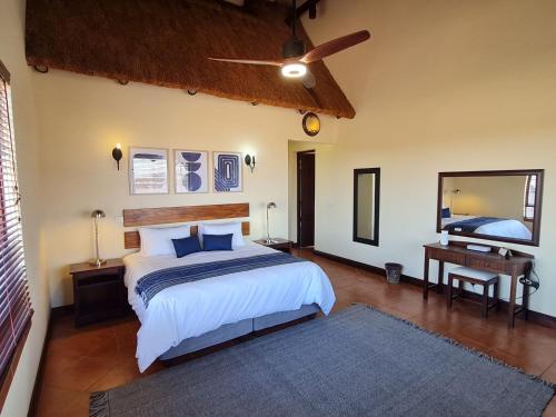 A bed or beds in a room at Zebula No 2 Waterbergs Over the Savannah 4 Bedroom