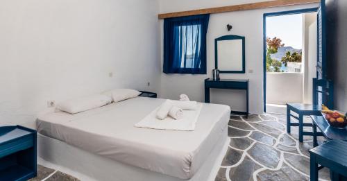 Säng eller sängar i ett rum på Lagada Beach Economy
