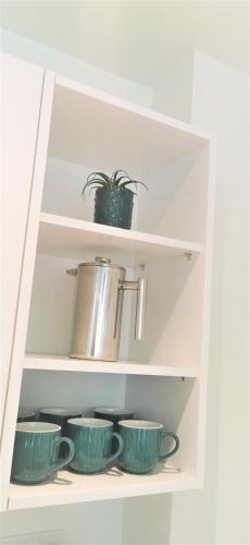 Η κουζίνα ή μικρή κουζίνα στο Sea Breeze, gorgeous 2 bed apartment in Exmouth