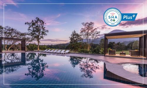 a rendering of a pool at a resort with the shka plus logo at Chatrium Golf Resort Soi Dao Chanthaburi in Ban Thap Sai