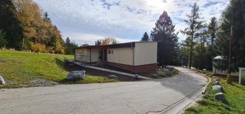 a small building on the side of a road at HOTEL SVRATKA in Svratka