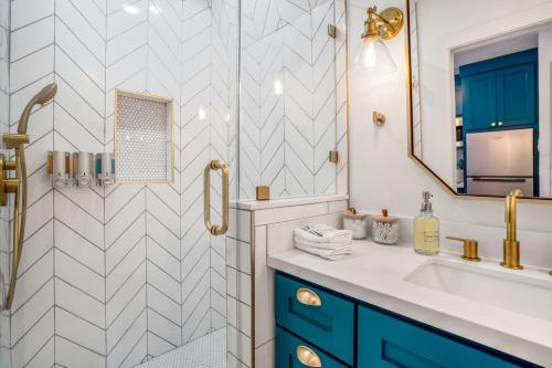 a bathroom with a sink and a shower at Unique A-frame Tiny House in Houston Central in Houston