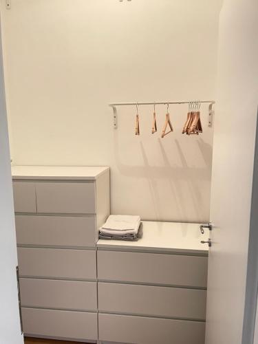 a bathroom with a white counter and some drawers at Appartamento Gasparo da Salò in Salò