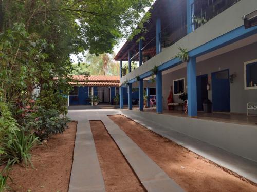 an empty walkway in front of a building at Suits - Canto do sabia in Brotas