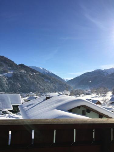 a view of a building with snow on the roof at Ferienwohnung Thöny Vandans in Vandans
