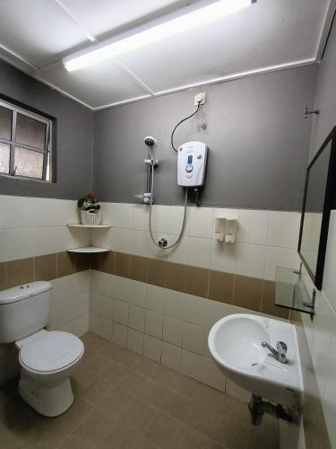 a bathroom with a toilet and a sink at Dream 1 in Cameron Highlands