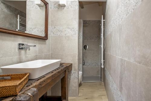 a bathroom with a sink and a shower at Casa Teresa con vista sul centro storico by Wonderful Italy in Modica