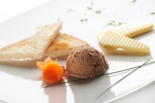 a plate of food with a chocolate ice cream and bread at Hiša Ančka, Šenčur - 3 min to the Airport in Šenčur