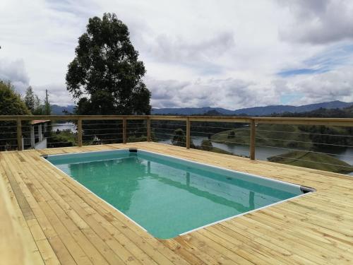 a swimming pool on the deck of a house at Finca Villa Sofia in El Peñol