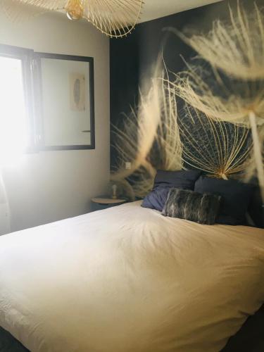 Ein Bett oder Betten in einem Zimmer der Unterkunft Spacieux logement Ax-les-thermes