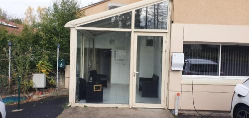 a large sliding glass door of a house at Le Mordene - WIFI - Parking in Issoire