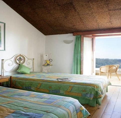 Ένα ή περισσότερα κρεβάτια σε δωμάτιο στο Estalagem Abrigo da Montanha