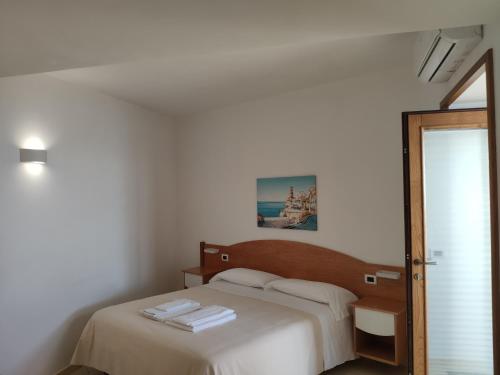 Ένα ή περισσότερα κρεβάτια σε δωμάτιο στο B&B Il Nespolo