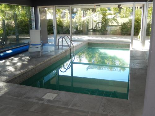 a swimming pool in a house at Solares de Araus 406 in Colonia del Sacramento
