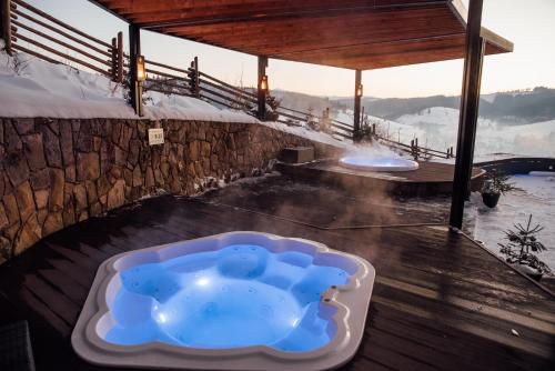 a jacuzzi tub in the middle of a building at Stara Pravda Hotel in Bukovel