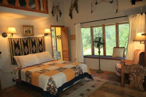 a bedroom with a bed and a window at Spirit Tree Inn B&B in Patagonia