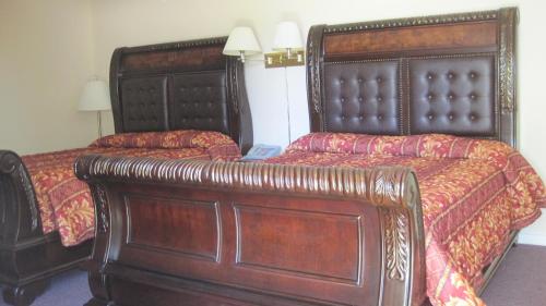 Ένα ή περισσότερα κρεβάτια σε δωμάτιο στο Rosecourt Motel