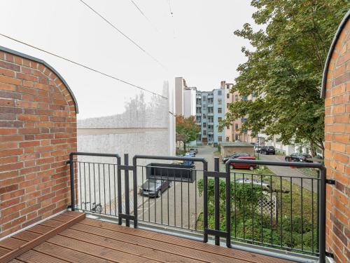 a balcony with a view of a street at Limehome Magdeburg Breiter Weg in Magdeburg