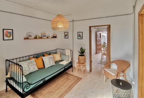 a living room with a couch and a table at Algarve house, sun, terrace, views and barbecue in Silves