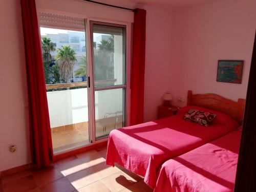 En eller flere senger på et rom på Isleta del Moro TERRAZA VISTAS MAR Exclusiva 60 m2 WIFI