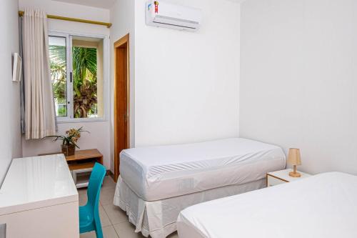 Ένα ή περισσότερα κρεβάτια σε δωμάτιο στο Village Enseada Ville, Itacimirim, Bahia
