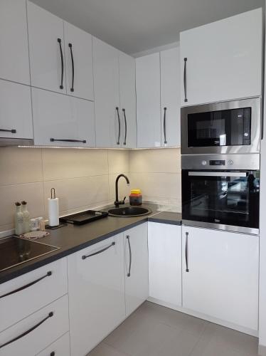 Virtuvė arba virtuvėlė apgyvendinimo įstaigoje Apartment M & N